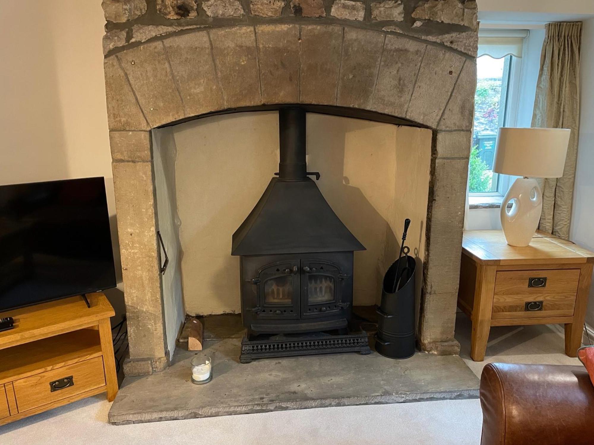 Hotel Ashfield House à Grassington Chambre photo The fireplace in the living room
